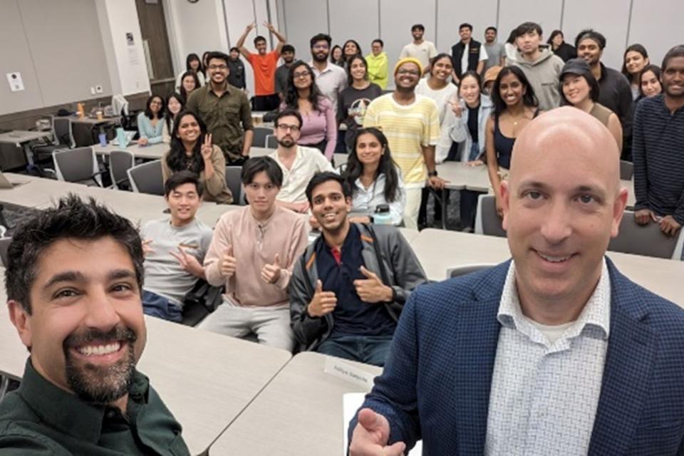 MakAhmad and Marco Casalaina take a selfie with MSBA students