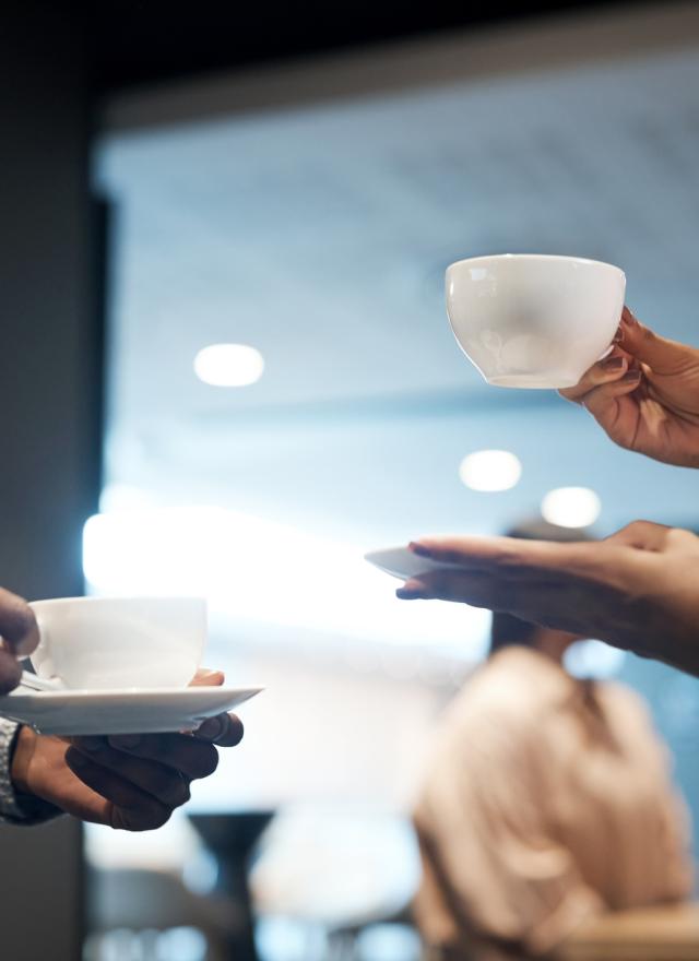 Coworkers getting coffee - iStock image