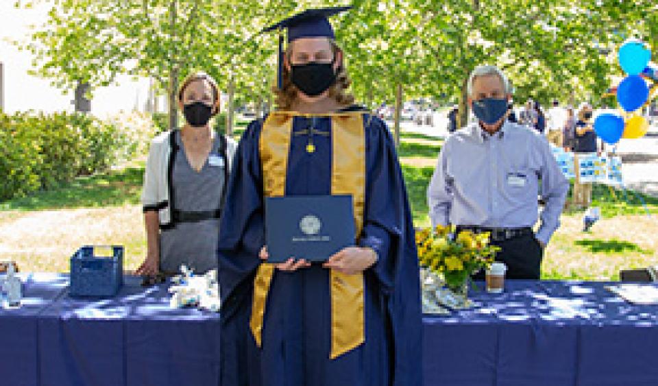 Kyle Gillingwater at commencement with Hollis Skaife and Will Snyder 