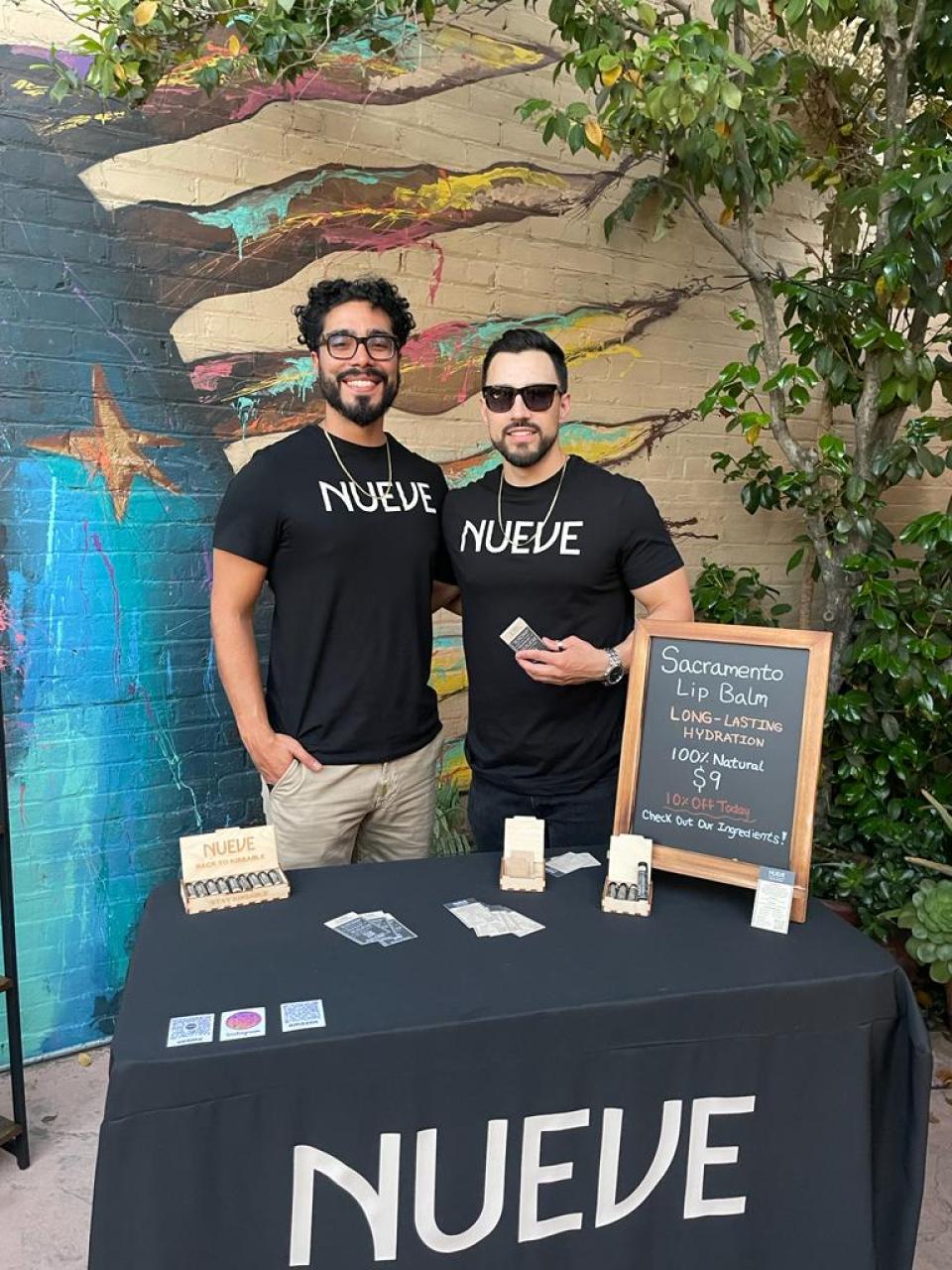 Antonio Hurtado selling Nueve lip balm at farmer's market