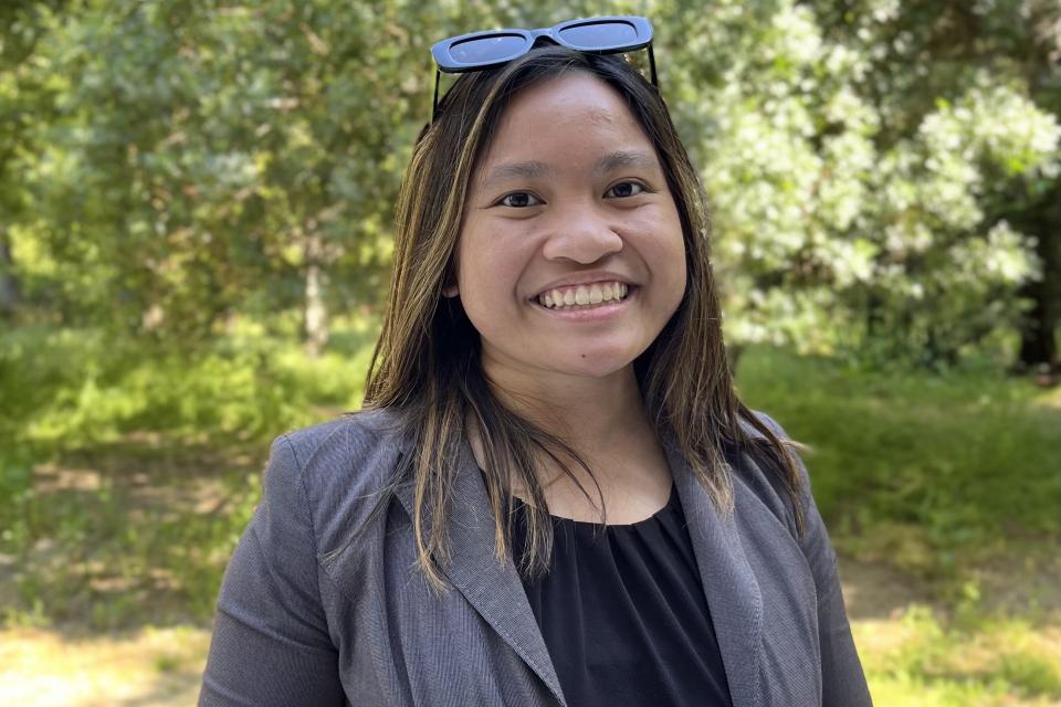 Angelina Cayabyab smiling and standing outside Gallagher Hall